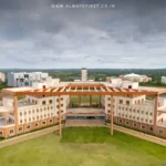 Aerial view of a modern IIT campus with students walking, symbolizing expansion in technical education