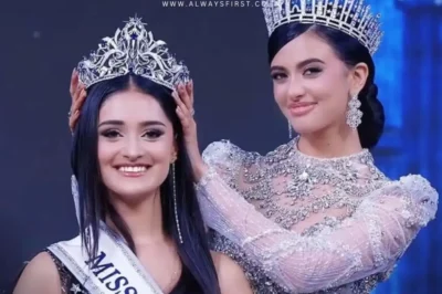 Manika Vishwakarma, Miss Universe India 2025 winner, holding the crown with a radiant smile in her glamorous gown