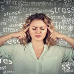 A senior woman practicing meditation to reduce stress, symbolizing age-related stress management.