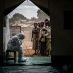 Medical teams in protective gear working at an Ebola treatment center in eastern Democratic Republic of Congo