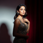 A glamorous portrait of Sobhita Dhulipala wearing a sophisticated designer outfit with elegant lighting reflecting her poised and star power.