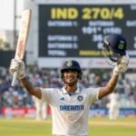 Ishan Kishan celebrating his double century during the Duleep Trophy final against the backdrop of a cheering stadium.