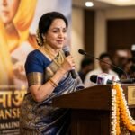 Hema Malini speaking at a press event about the spiritual success of the movie Hanuman Ansh.