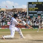 England batsmen Joe Root and Harry Brook celebrate a record-breaking partnership during the Test match against Pakistan in Multan.