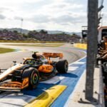 Lando Norris celebrates with his McLaren team after securing pole position at the Spanish Grand Prix.