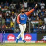 Indian mystery spinner Varun Chakaravarthy preparing to bowl in a T20 international match.