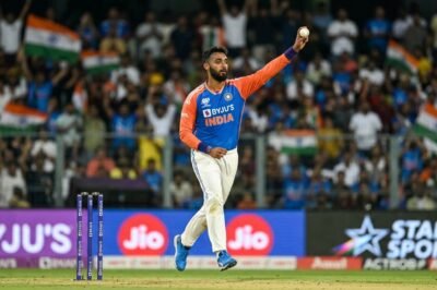 Indian mystery spinner Varun Chakaravarthy preparing to bowl in a T20 international match.