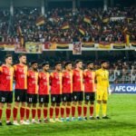 East Bengal FC players in their red and gold jerseys during a high-intensity AFC Champions League 2 match.