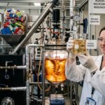 A laboratory demonstration of plastic waste being chemically converted into clear liquid fuel inside a high-pressure reactor vessel.