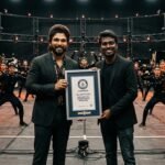 Allu Arjun and director Atlee standing proudly with the official Guinness World Record certificate on a high-tech movie set.