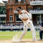 An intense action shot of an England batsman playing a sweep shot against a Sri Lankan spinner during the 2nd ODI at a sun-drenched stadium in 2026.