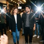 Alia Bhatt and Samay Raina walking together at the Don't Be Shy movie screening in Mumbai amidst flashing cameras.
