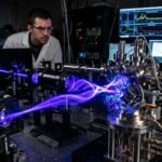 Conceptual scientific visualization of a structured blue laser beam twisting into a vortex and hitting a magnetic thin-film material to change its polarity.