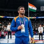 Nitesh Siwach of India standing on the podium with a silver medal around his neck at the Asian Games 2026.