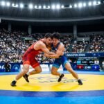 Elite wrestlers Yui Susaki, Sujeet Kalkal, and Amir Hossein Zare in action at the Asian Games 2026 wrestling championships.