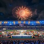 A wide-angle shot of the Aichi-Nagoya 2026 Asian Games closing ceremony featuring fireworks and athletes from across Asia.