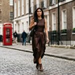 Bollywood actress Katrina Kaif walking in London wearing a trendy brown dhoti-style draped skirt and neutral top, showcasing Indo-Western fusion fashion.