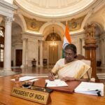 President Droupadi Murmu signing official documents at Rashtrapati Bhavan for the appointment of new state governors.