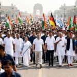 Rahul Gandhi leading a massive political march with INDIA bloc leaders through the streets of New Delhi toward the Supreme Court.