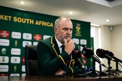 South Africa cricket coach Shukri Conrad speaking at a press conference with a serious expression after the Durban Test match.