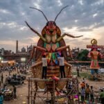 A giant 30-foot cockroach effigy being prepared for the Ramlila festival in Delhi, standing tall next to traditional Ravan figures.