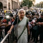 Social activist Medha Patkar exiting a Delhi courtroom following her conviction in a long-standing defamation case.