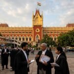 The majestic exterior of the Calcutta High Court representing the judicial authority in West Bengal.