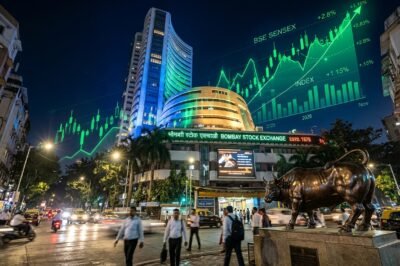 Traders monitoring green stock market tickers showing Sensex and Nifty at record highs after RBI dividend announcement.